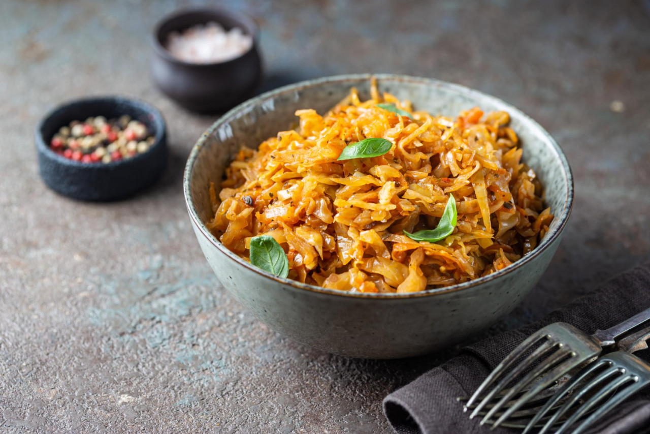 stewed braised cabbage served bowl dark stone background close up