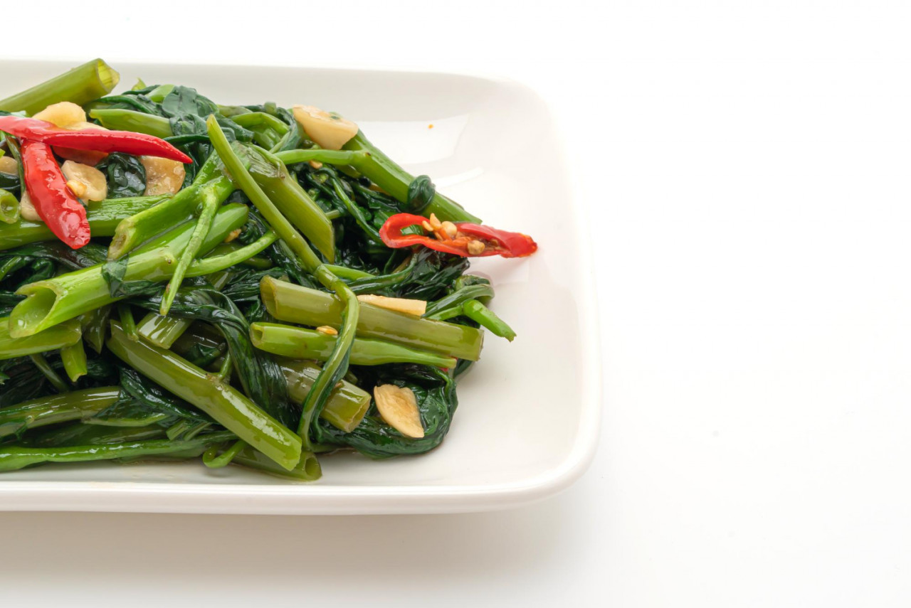 stir fried chinese morning glory water spinach isolated white background