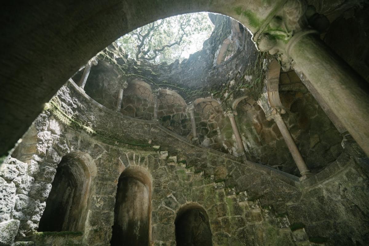 stone initiation well at quinta da regaleira in portugal