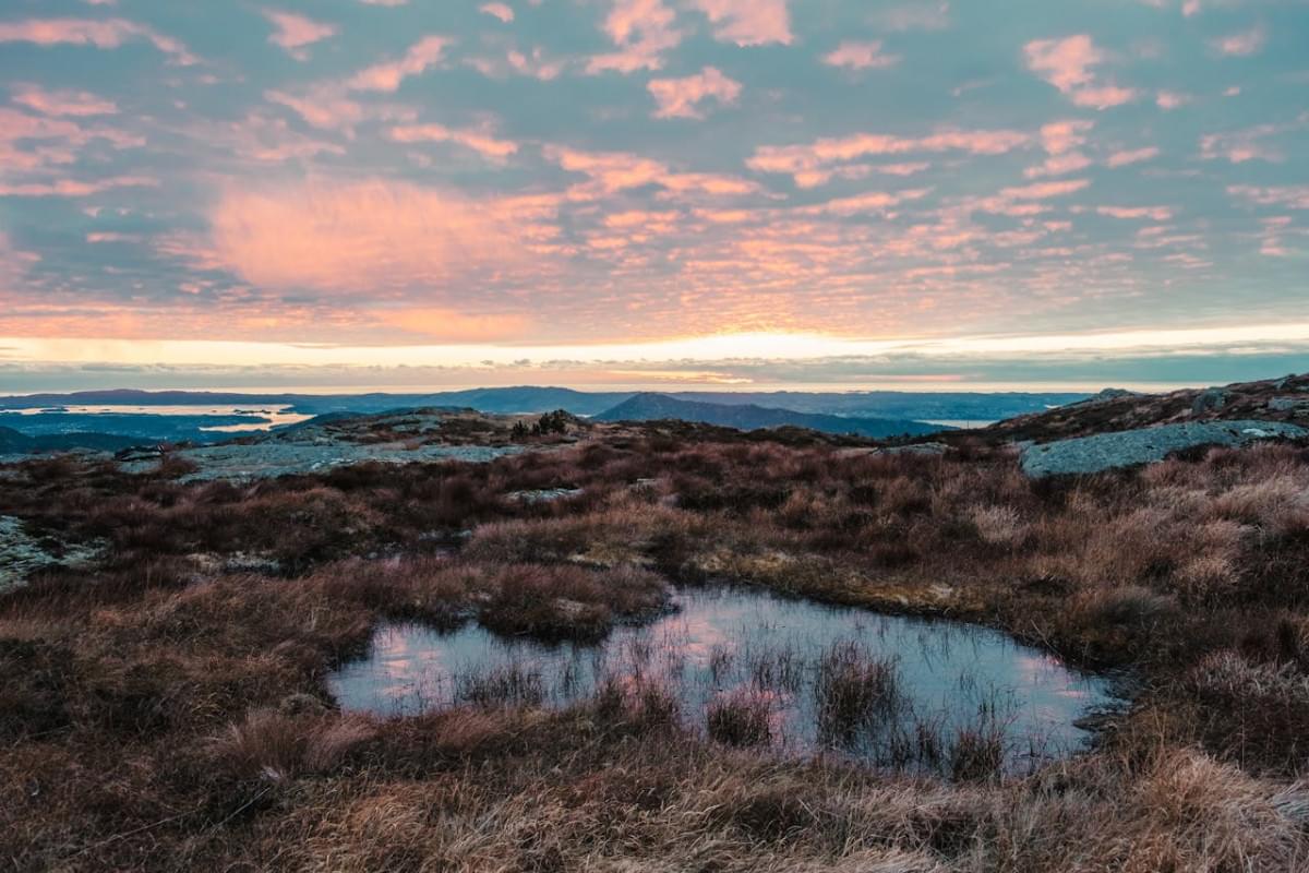 sunset from the top of a high mountain in norway 1