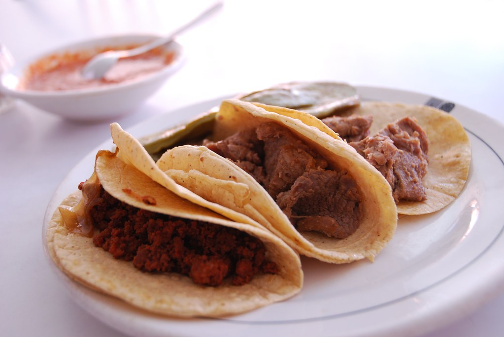tacos a mexican dish made with maize tortillas