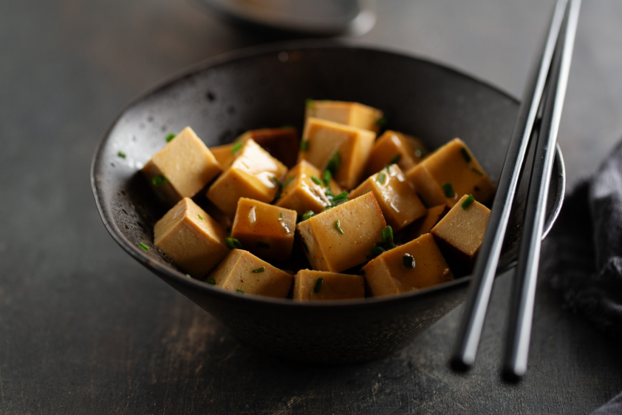 tasty appetizing chunks tofu with sauce served bowl ready eating closeup