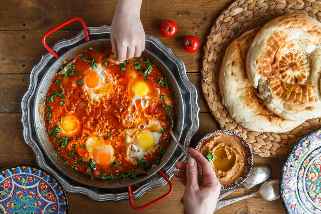 tasty family breakfast with shakshuka bread hummus rustic style