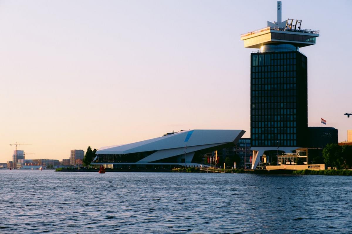 the adam tower seen from the canal in amsterdam netherlands