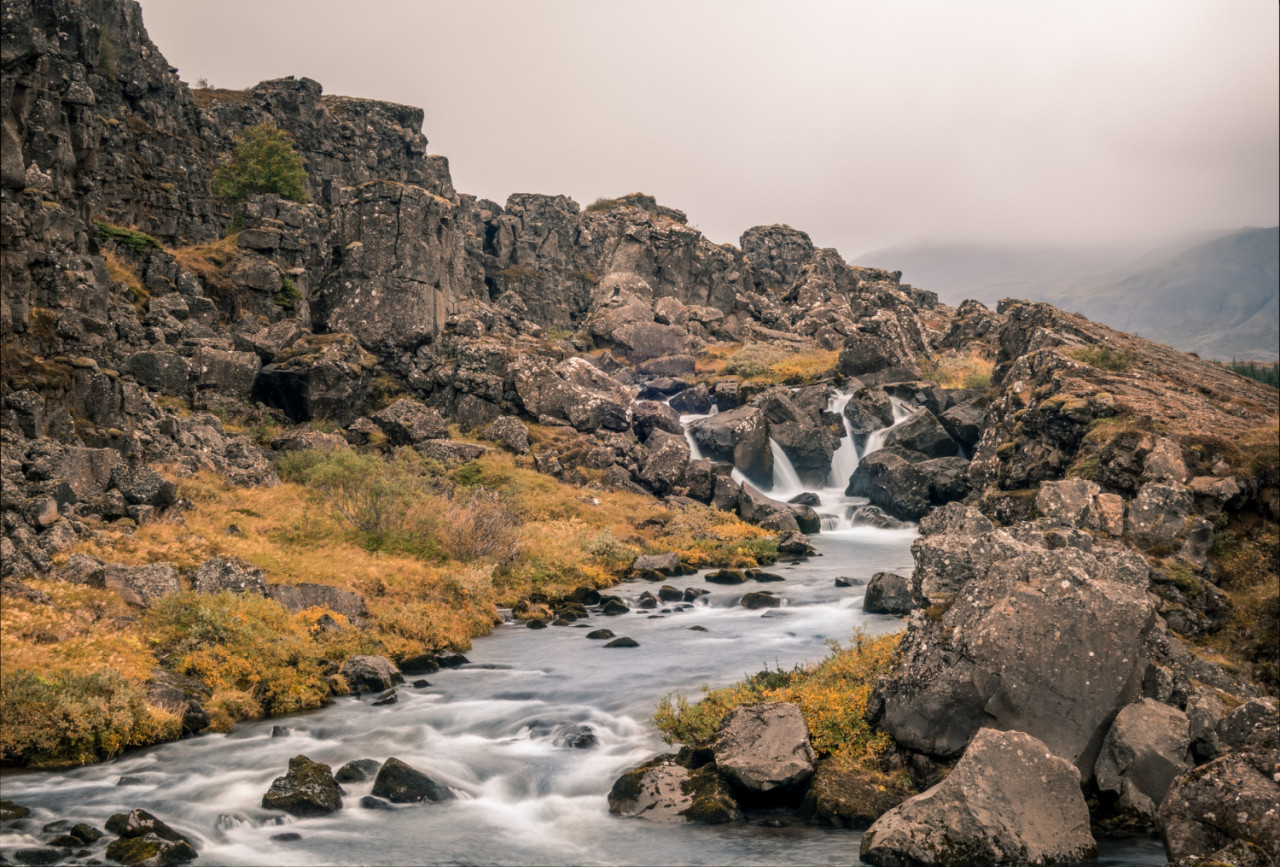 the river flowing through the rocks captured in thingvellir national park in iceland