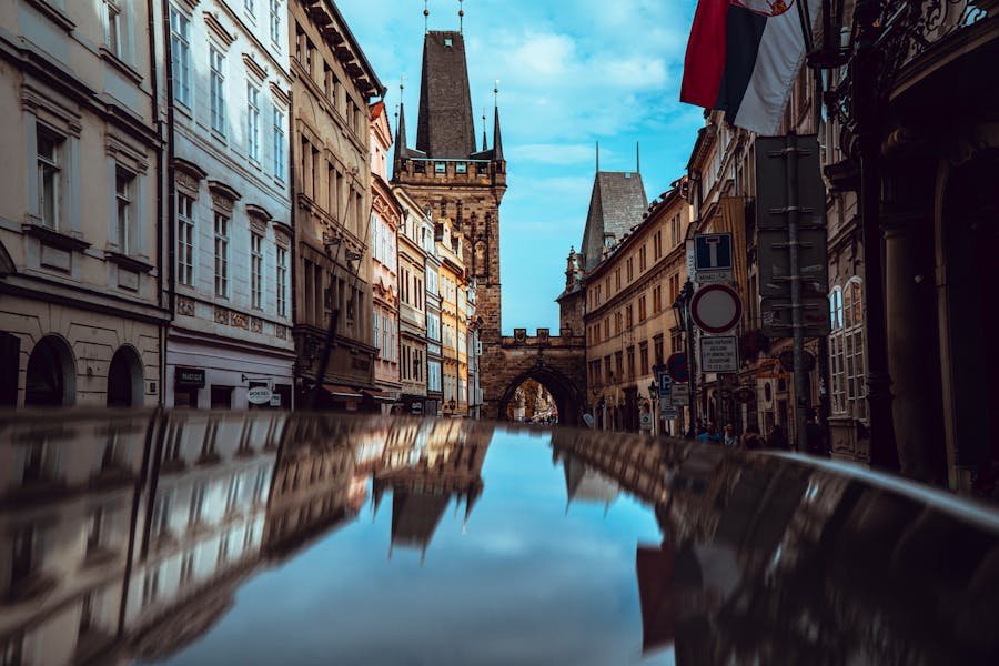 townhouses by the street leading to the mal strana bridge tower in prague czech republic