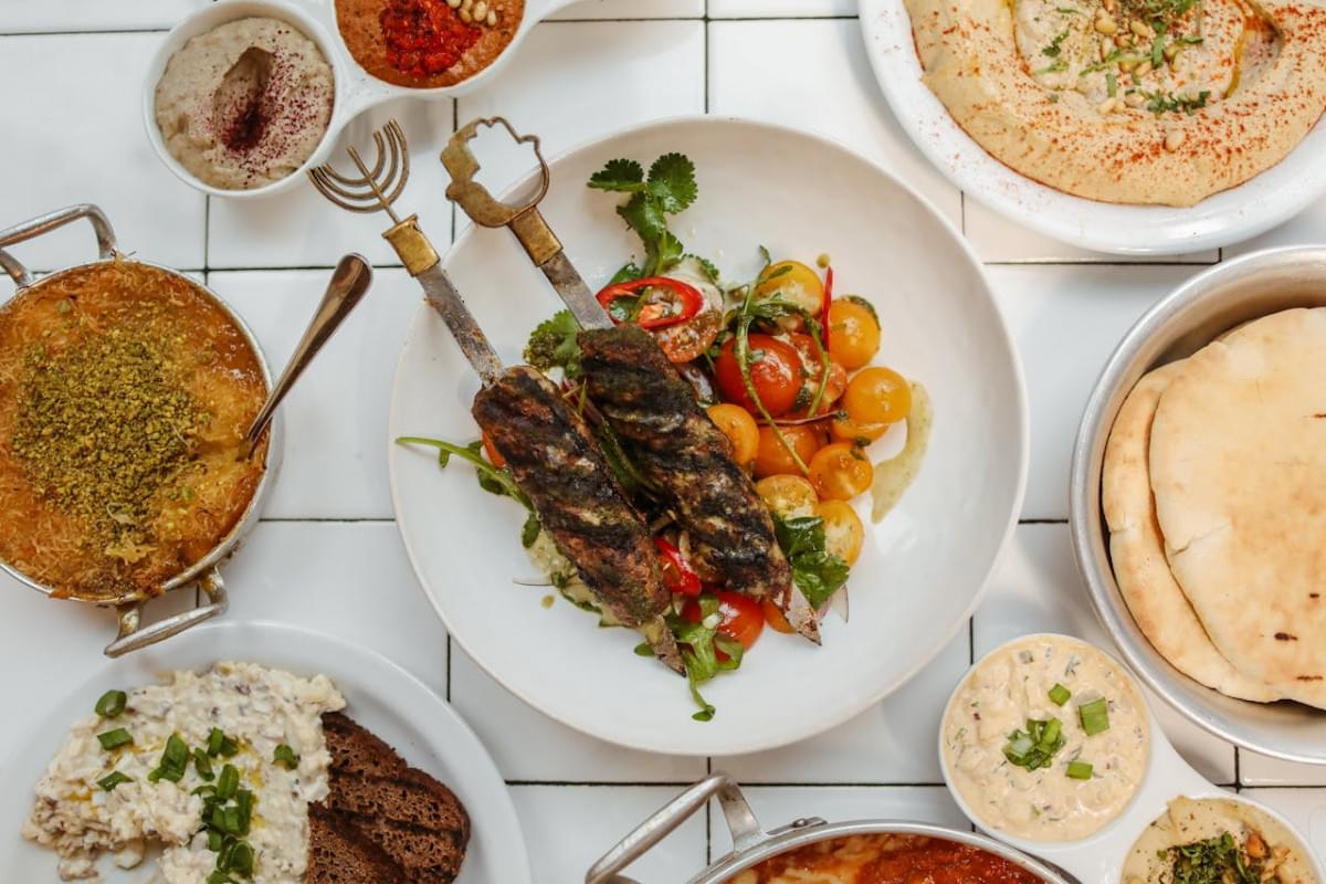 traditional foods over white ceramic tiles 1
