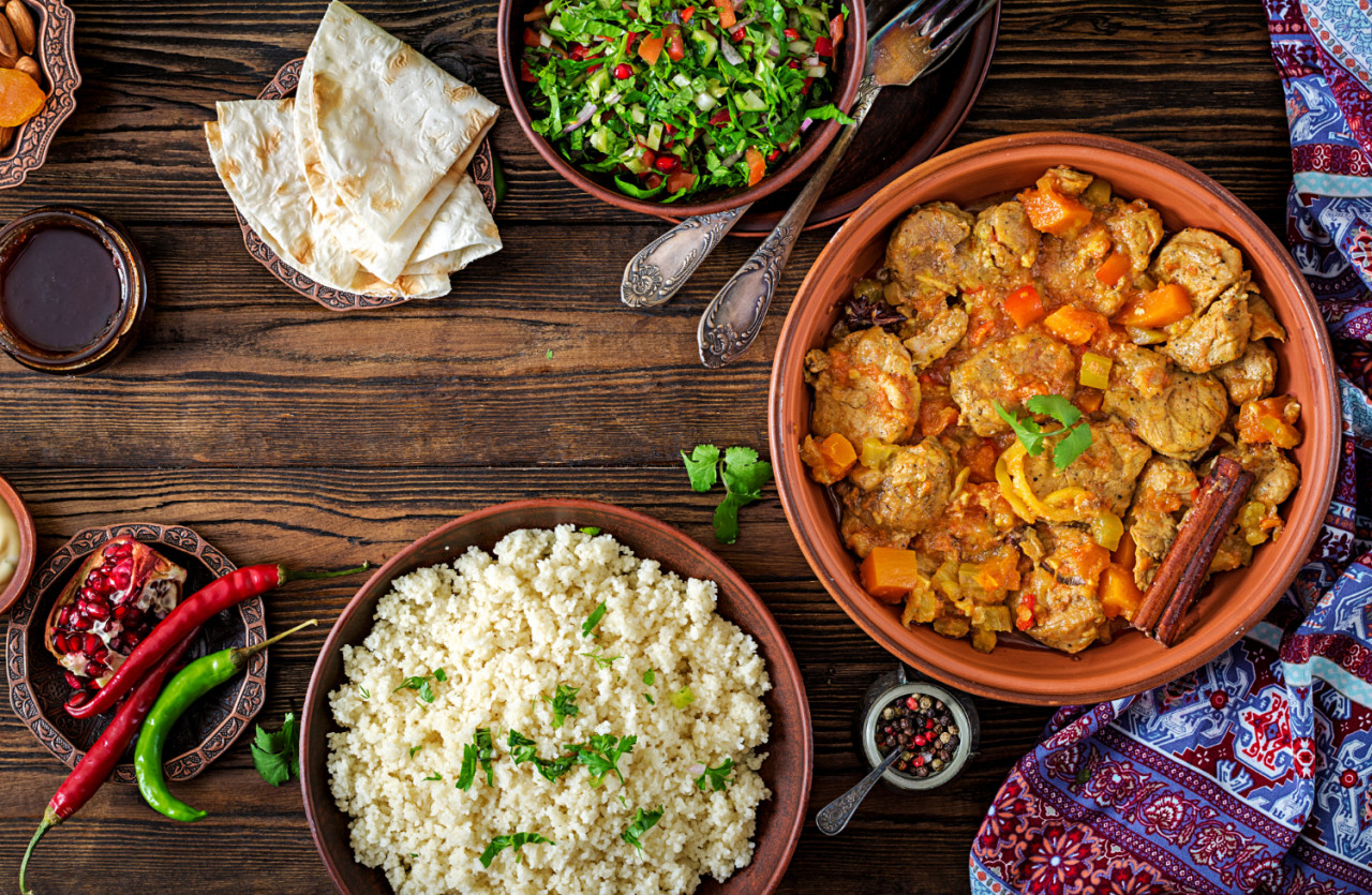 traditional tajine dishes couscous fresh salad rustic wooden table tagine lamb meat pumpkin top view flat lay