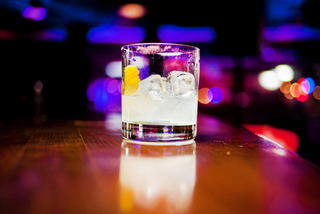 trendy alcoholic cocktail drink with vodka coffee liqueur cream ice dark background