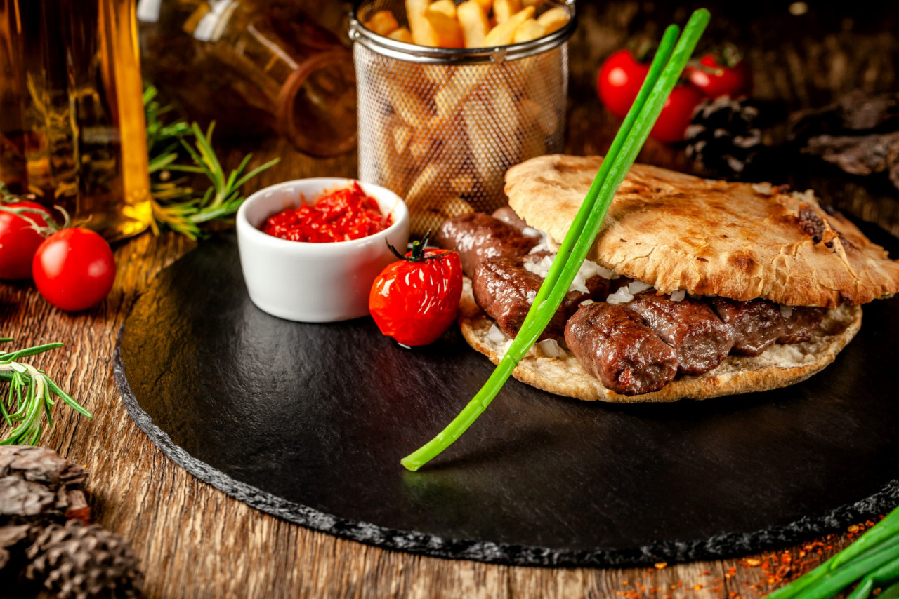 turkish oriental cuisine turkish tortilla bun pita bread with kebab pickled onions serving restaurant black slate wooden table