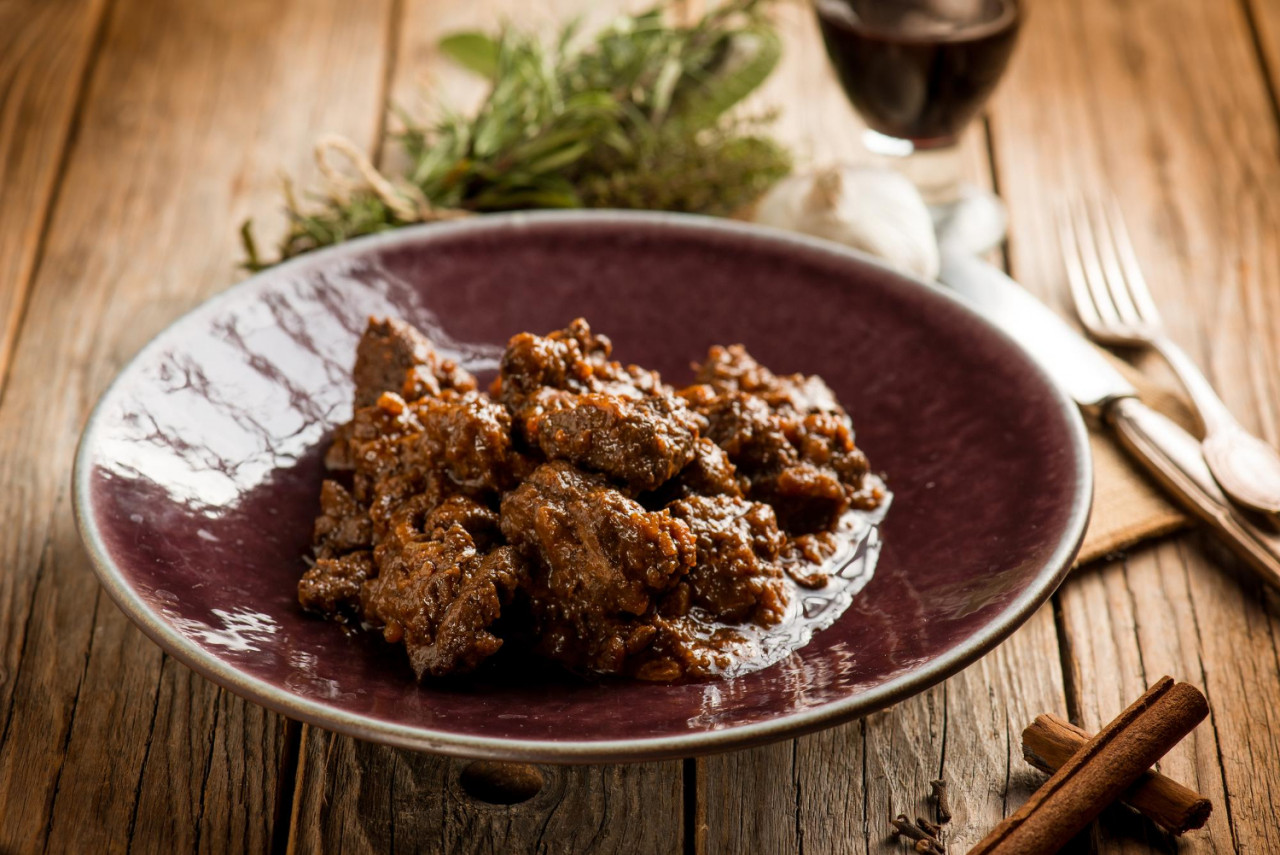 venison stew traditional italian recipe glass red wine