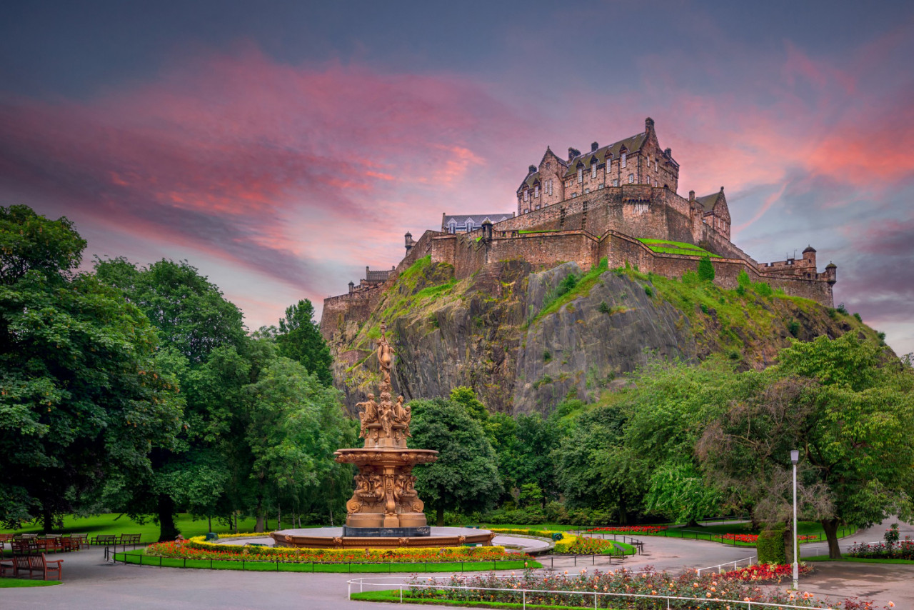 view edinburgh castle from princes street gardens with ross fountain foreground