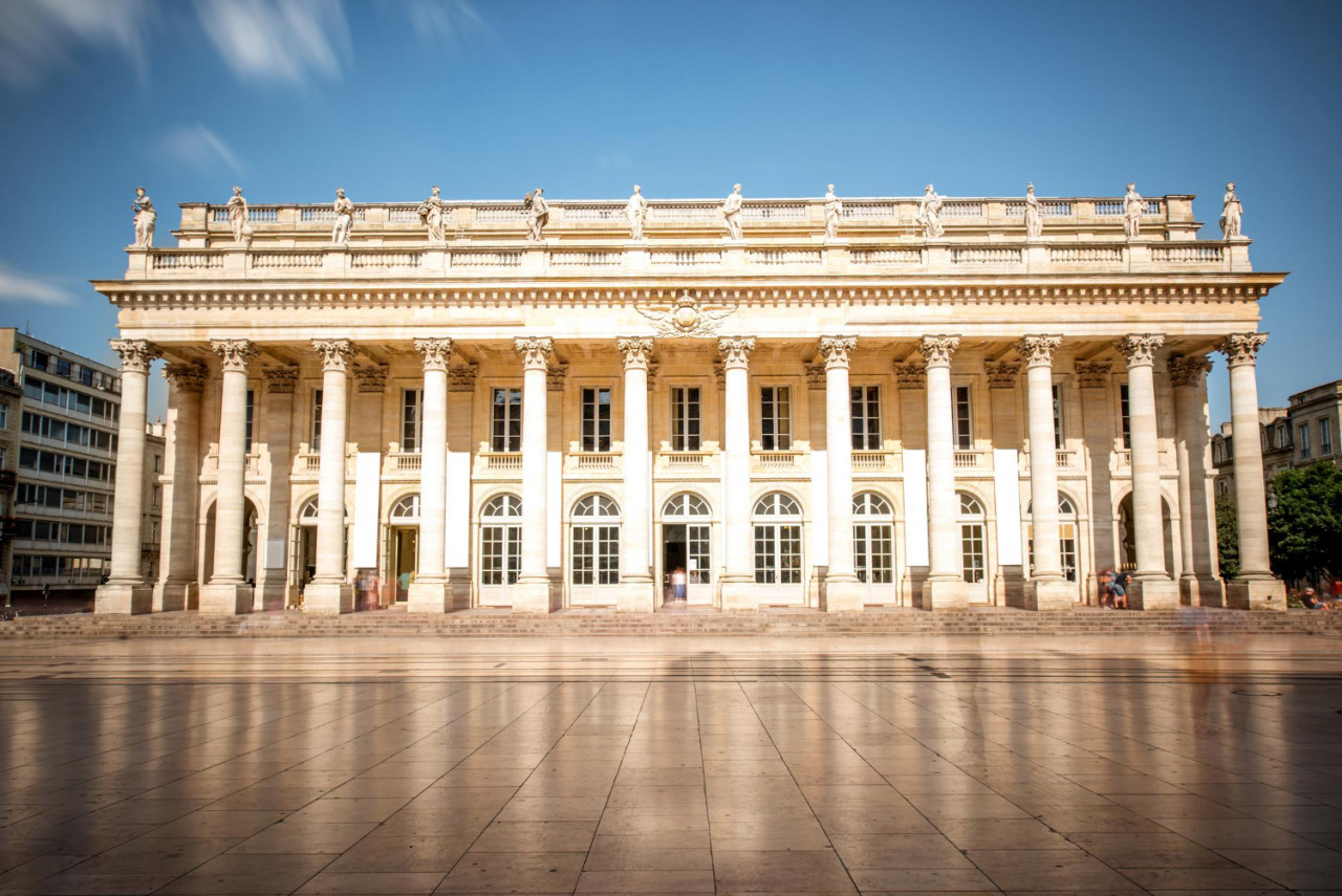 view facade grand theatre building bordeaux city france long exposure image technic with motion blurred people clouds
