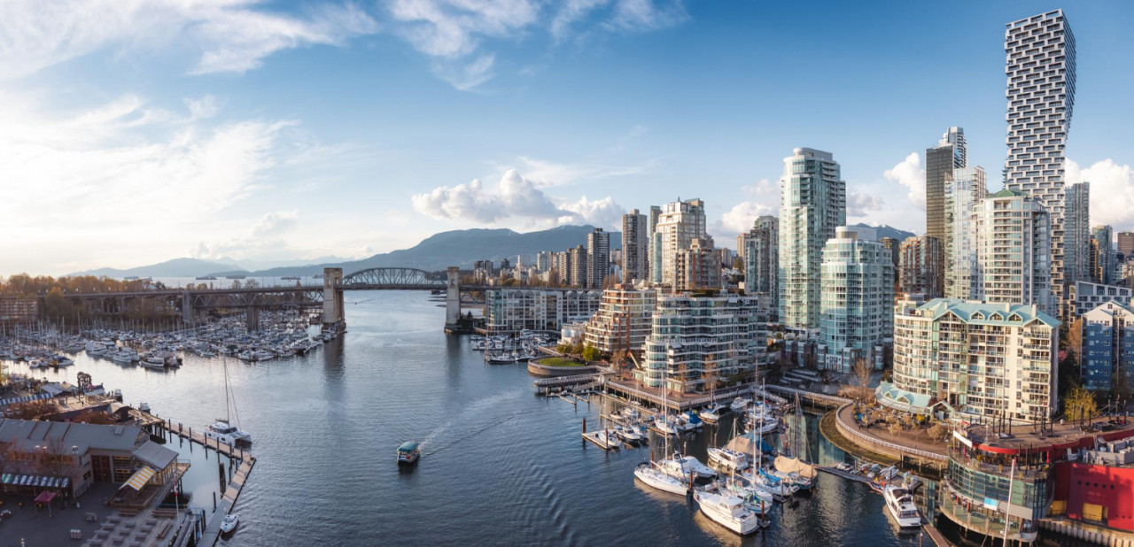 view granville island false creek with modern city skyline