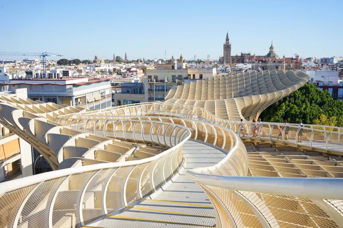 walking on with railing on top of metropol parasol building