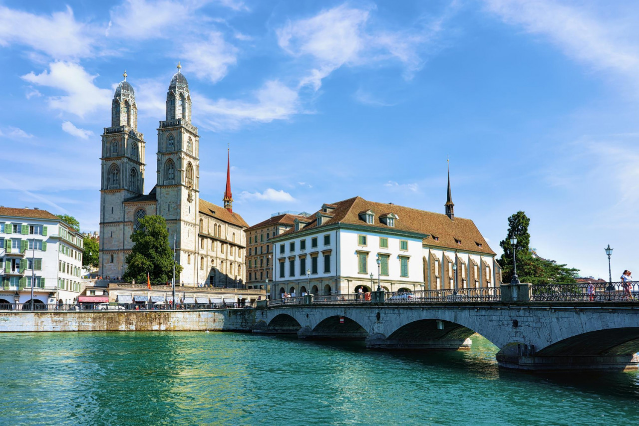 zurich switzerland september 2 2016 limmat river quay with grossmunster church zurich switzerland